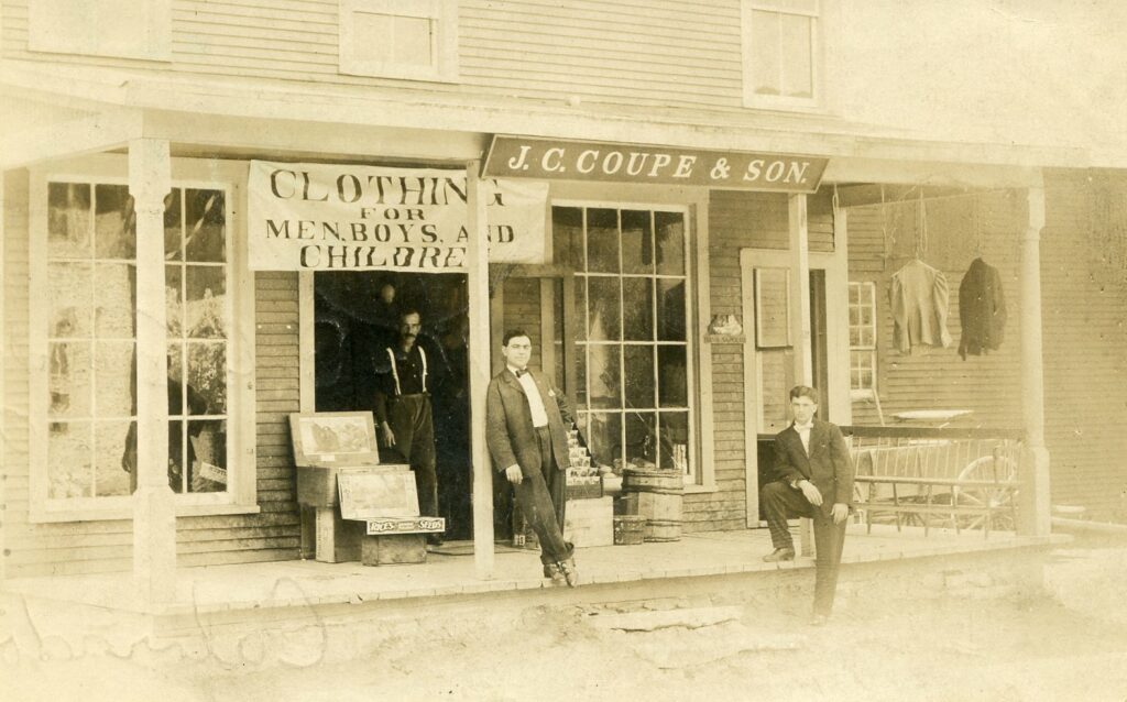 J.C. Coupe & Son Clothing Store. Was the building that is formerly Nichols Store. Postmark is 1908. 